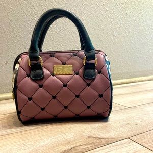 A purple white and black Betsy Johnson